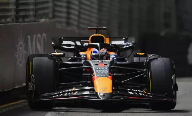 Red Bull driver Max Verstappen of the Netherlands steers his car during the Singapore Formula One Grand Prix at the Marina Bay Street Circuit, in Singapore, Sunday, Sept. 22, 2024. (AP Photo/Vincent Thian)