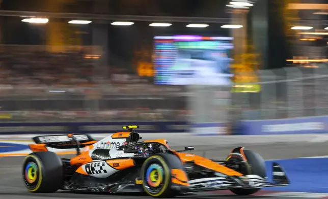 McLaren driver Lando Norris of Britain steers his car during the Singapore Formula One Grand Prix at the Marina Bay Street Circuit, in Singapore, Sunday, Sept. 22, 2024. (AP Photo/Vincent Thian)