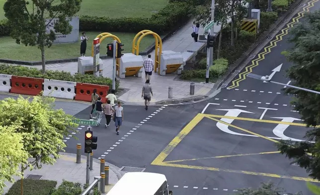 Anti-crash vehicle barriers are seen installed along the pavement outside Parliament House, where Pope Francis is scheduled to meet Singapore Prime Minister Lawrence Wong and President Tharman Shanmugaratnam, in Singapore, Saturday, Sept. 7, 2024. (AP Photo/Suhaimi Abdullah)