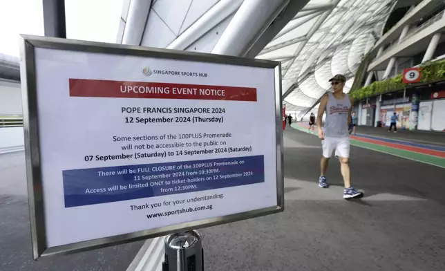 An event notice is seen outside the National Stadium ahead of the visit of Pope Francis in Singapore, Sunday, Sept. 8, 2024. (AP Photo/Suhaimi Abdullah)