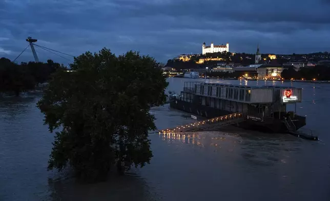 View of the Bratislava castle as the water level of the Danube river rises during recent floods in Slovakia, Monday, Sept. 16, 2024. (AP Photo/Tomas Hrivnak)