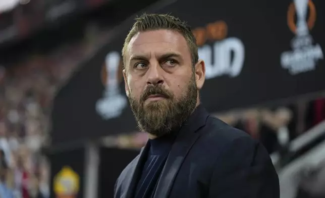 FILE - Roma's head coach Daniele De Rossi waits for the start of the Europa League second leg semi-final soccer match between Leverkusen and Roma at the BayArena in Leverkusen, Germany, Thursday, May 9, 2024. (AP Photo/Matthias Schrader, File)