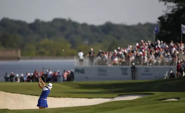 Europe's Anna Nordqvist hits from a bunker on the 15th hole during a Solheim Cup golf tournament fourball match at Robert Trent Jones Golf Club, Saturday, Sept. 14, 2024, in Gainesville, Va. (AP Photo/Matt York)