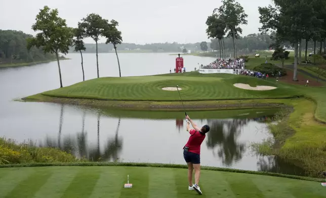 United States' Ally Ewing hits from the 11th tee during a Solheim Cup golf tournament foursomes match at Robert Trent Jones Golf Club, Friday, Sept. 13, 2024, in Gainesville, VA. (AP Photo/Matt York)