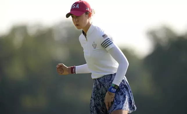 United States' Nelly Korda celebrates after sinking a putt on the 10th hole during a Solheim Cup golf tournament foursome match at Robert Trent Jones Golf Club, Saturday, Sept. 14, 2024, in Gainesville, Va. (AP Photo/Matt York)