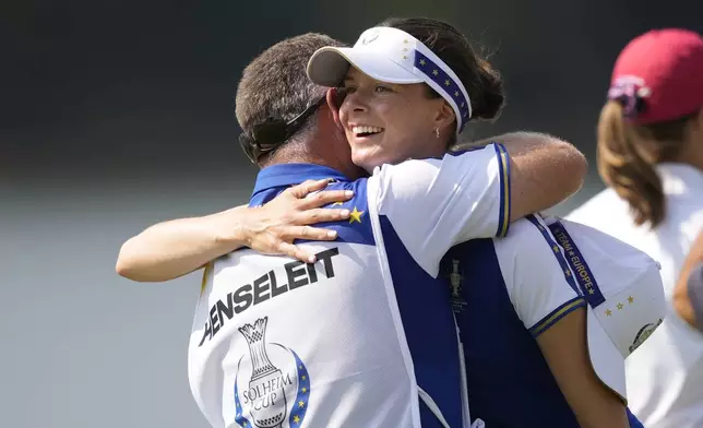 Europe's Esther Henseleit celebrates after winning a foursome match during a Solheim Cup golf tournament at Robert Trent Jones Golf Club, Saturday, Sept. 14, 2024, in Gainesville, Va. (AP Photo/Matt York)