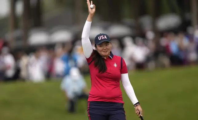 United States' Allisen Corpuz celebrates on the 16th green after winning foursomes match during a Solheim Cup golf tournament at Robert Trent Jones Golf Club, Friday, Sept. 13, 2024, in Gainesville, Va. (AP Photo/Matt York)