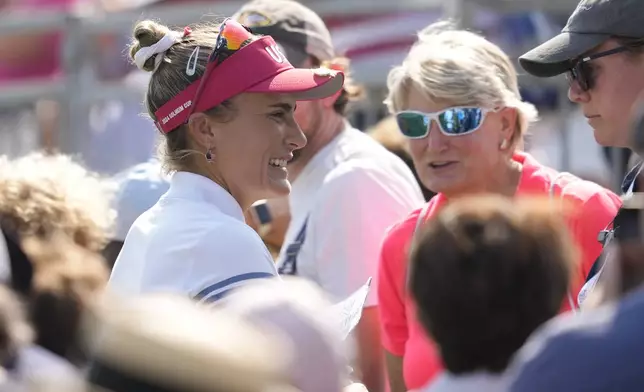 United States' Lexi Thompson smiles after winning a foursome match during a Solheim Cup golf tournament at Robert Trent Jones Golf Club, Saturday, Sept. 14, 2024, in Gainesville, Va. (AP Photo/Matt York)