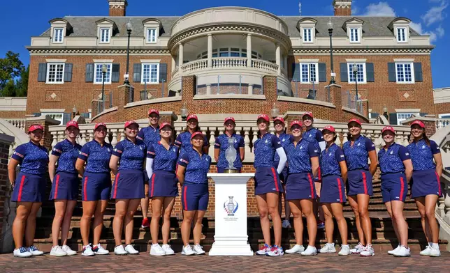 Team USA poses for a team photograph prior to the start of the Solheim Cup golf tournament at the Robert Trent Jones Golf Club, Tuesday, Sept. 10, 2024, in Gainesville, Va. (AP Photo/Matt York)