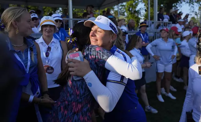 Europe's Emily Pedersen celebrates winning a fourball match during a Solheim Cup golf tournament at Robert Trent Jones Golf Club, Saturday, Sept. 14, 2024, in Gainesville, Va. (AP Photo/Chris Szagola)