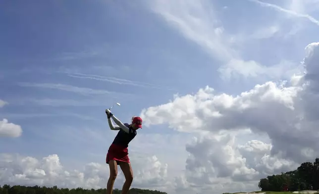 United States' Nelly Korda hits on the 12th hole during a Solheim Cup golf tournament fourball match at Robert Trent Jones Golf Club, Friday, Sept. 13, 2024, in Gainesville, Va. (AP Photo/Matt York)