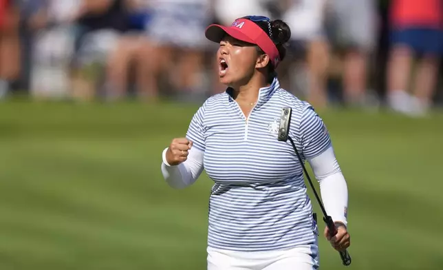 United States' Megan Khang celebrates after making a putt on the 14th hole during a Solheim Cup golf tournament fourball match at Robert Trent Jones Golf Club, Saturday, Sept. 14, 2024, in Gainesville, Va. (AP Photo/Chris Szagola)