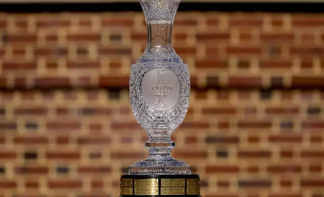 The Solheim Cup is shown during team portraits prior to the start of the Solheim Cup golf tournament at the Robert Trent Jones Golf Club, Tuesday, Sept. 10, 2024, in Gainesville, VA. (AP Photo/Matt York)