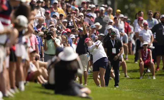 United States' Ally Ewing hits from the 18th fairway during a Solheim Cup golf tournament foursome match at Robert Trent Jones Golf Club, Saturday, Sept. 14, 2024, in Gainesville, Va. (AP Photo/Matt York)