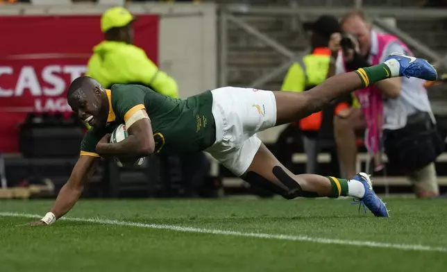 South Africa's Aphelele Fassi scores a try against Argentina during a rugby championship test match at Mbombela stadium in Nelspruit, South Africa, Saturday, Sept. 28, 2024. (AP Photo/Themba Hadebe)