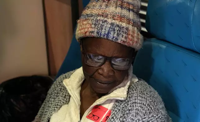 A patient wearing her new pair of glasses on the Phelophepa eye clinic carriage, in Tembisa, east of Johannesburg, South Africa, Thursday, Aug. 22, 2024. (AP Photo/Themba Hadebe)