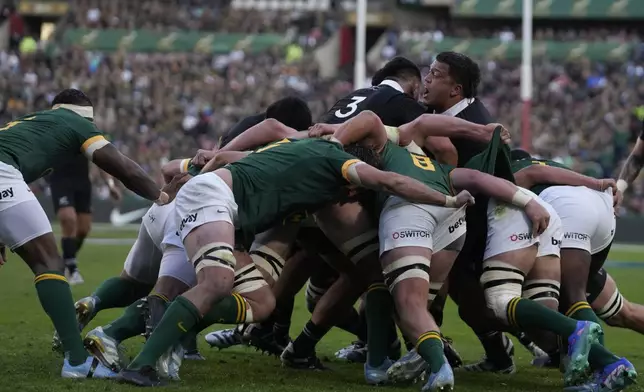 Players battle for the ball during a rugby championship test match between South Africa and New Zealand at Ellis Park stadium in Johannesburg, South Africa, Saturday, Aug. 31, 2024. (AP Photo/Themba Hadebe)