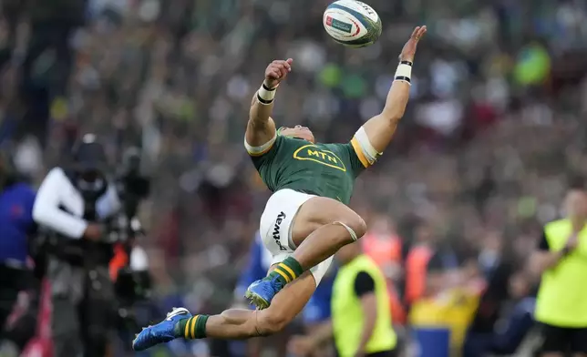 South Africa's Cheslin Kolbe jumps for the ball during a rugby championship test match between South Africa and New Zealand at Ellis Park stadium in Johannesburg, South Africa, Saturday, Aug. 31, 2024. (AP Photo/Themba Hadebe)