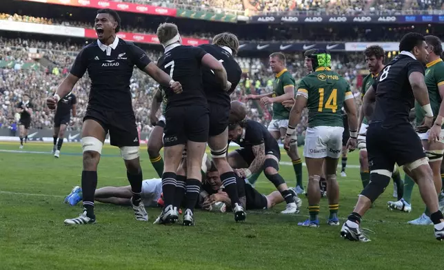 New Zealand's Tupou Vaa'i, left, celebrates after teammate scored a try during a rugby championship test match between South Africa and New Zealand at Ellis Park stadium in Johannesburg, South Africa, Saturday, Aug. 31, 2024. (AP Photo/Themba Hadebe)