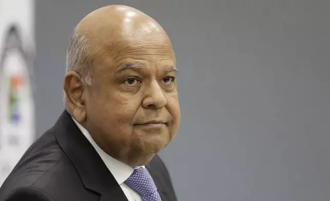 FILE - South Africa's Public Enterprises Minister Pravin Gordhan appears at the judicial commission of inquiry into state capture in Johannesburg, South Africa, Nov. 19, 2018. (AP Photo/Themba Hadebe, File)