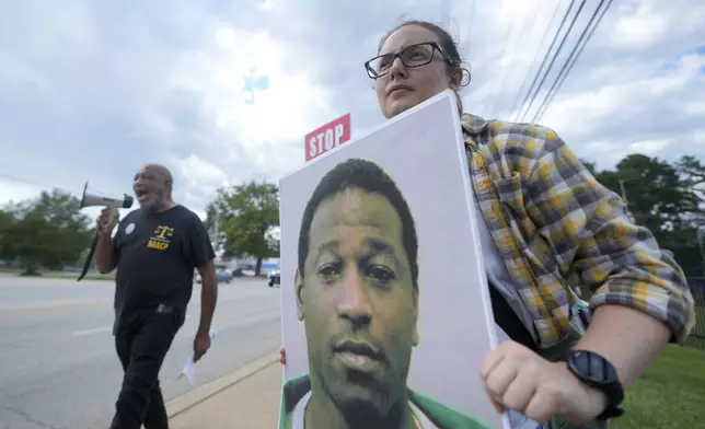 Rev. Hillary Taylor protests the planned execution of Freddie Eugene Owens, 46, on Friday, Sept. 20, 2024, in Columbia, S.C. Owens is set to be the first person to be executed in South Carolina in 13 years. (AP Photo/Chris Carlson)