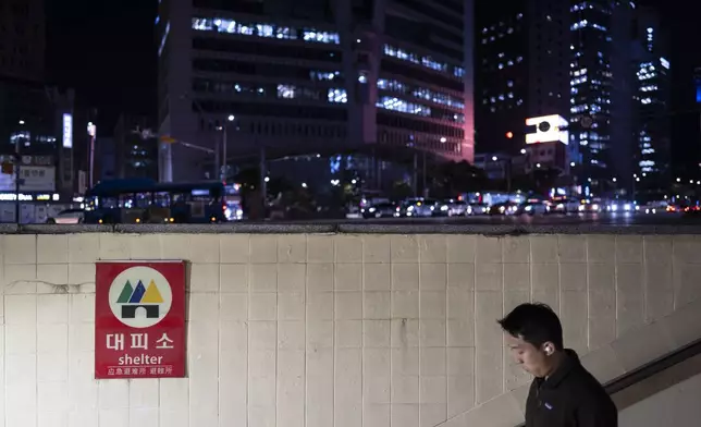 A man walks down the steps of a metro station that doubles as an emergency shelter in Seoul, South Korea, Monday, May 27, 2024. (AP Photo/Jae C. Hong)