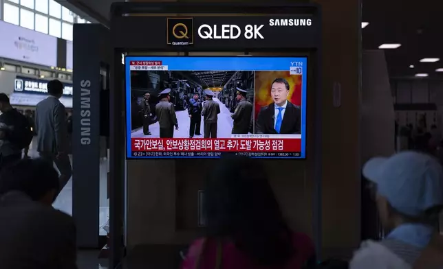 Commuters watch a news channel at Seoul Station in Seoul, Tuesday, May 28, 2024, showing North Korean leader Kim Jong Un after a rocket launched by North Korea to deploy a spy satellite exploded shortly after launch the previous day. (AP Photo/Jae C. Hong)