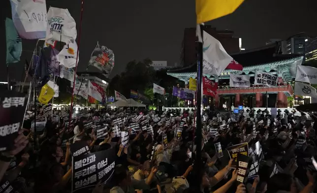 Feminist activists stage a rally against illegal deepfake content calling for the government to enact appropriate countermeasures in Seoul, South Korea, Friday, Sept. 6, 2024. The banners read "Regulate internet platforms that encourage deepfake sexual crimes." (AP Photo/Ahn Young-joon)