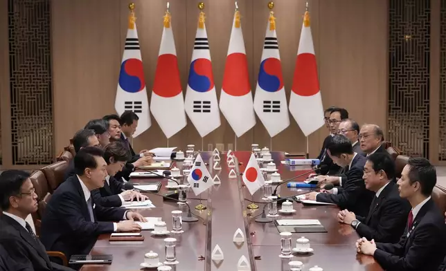 South Korean President Yoon Suk Yeol, second left, and Japanese Prime Minister Fumio Kishida, second right, attend a meeting at the Presidential Office in Seoul, South Korea, Friday, Sept. 6, 2024. (AP Photo/Lee Jin-man, Pool)