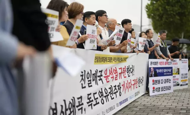 Protesters attend a rally opposing a planned meeting between South Korean President Yoon Suk Yeol and Japanese Prime Minister Fumio Kishida near the Presidential Office in Seoul, South Korea, Friday, Sept. 6, 2024. (AP Photo/Lee Jin-man)