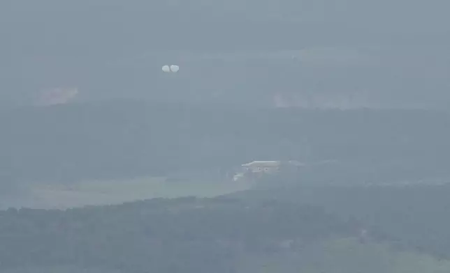 Balloons are seen from the Unification Observation Post in Paju, South Korea, near the border with North Korea, Thursday, Sept. 5, 2024. (AP Photo/Lee Jin-man)