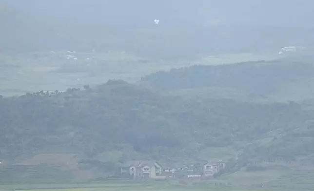 Balloons are seen from the Unification Observation Post in Paju, South Korea, near the border with North Korea, Thursday, Sept. 5, 2024. (AP Photo/Lee Jin-man)