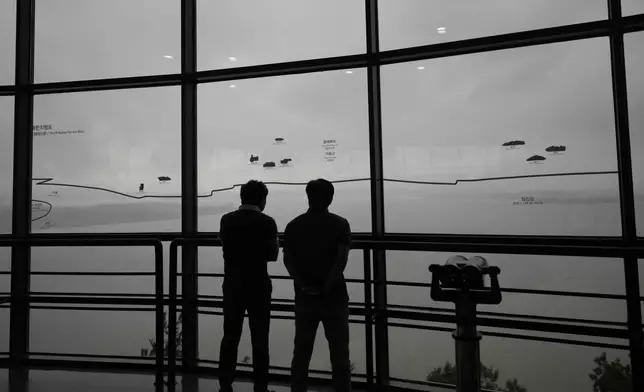 Visitors look at the North Korean side from the unification observatory in Paju, South Korea, Thursday, Sept. 5, 2024. (AP Photo/Lee Jin-man)