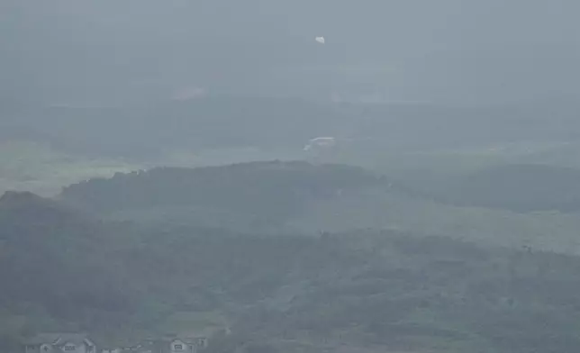 Balloons are seen from the Unification Observation Post in Paju, South Korea, near the border with North Korea, Thursday, Sept. 5, 2024. (AP Photo/Lee Jin-man)