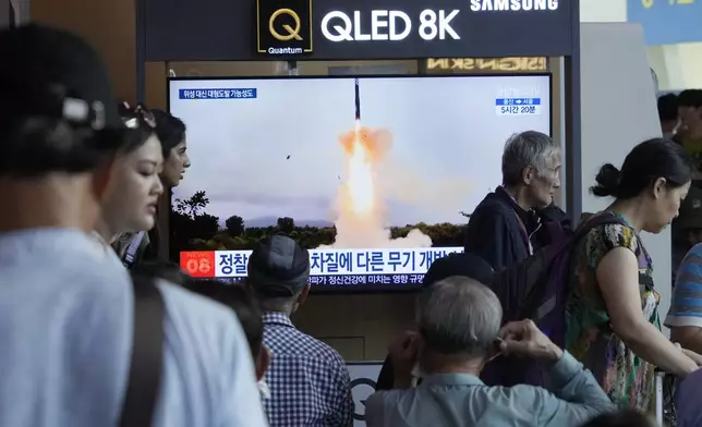 A TV screen shows a file image of North Korea's missile launch during a news program at Seoul Railway Station in Seoul, South Korea, Wednesday, Sept. 18, 2024. (AP Photo/Ahn Young-joon)