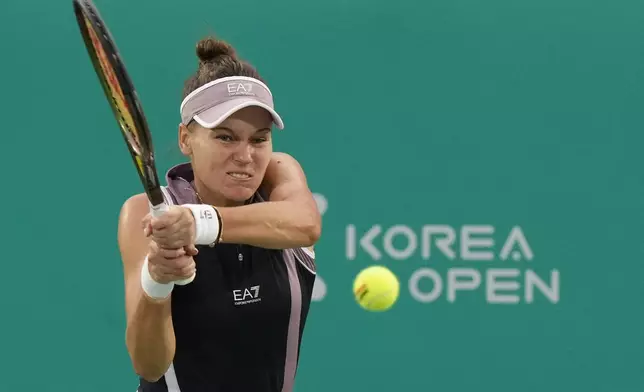 Veronika Kudermetova of Russia returns a shot to Beatriz Haddad Maia of Brazil during their semi final match of the Korea Open tennis championships in Seoul, South Korea, Saturday, Sept. 21, 2024. (AP Photo/Ahn Young-joon)