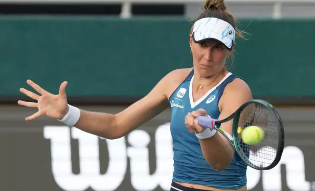 Beatriz Haddad Maia of Brazil returns a shot to Ajla Tomljanovic of Australia during their quarterfinal match at the Korea Open tennis championships in Seoul, South Korea, Thursday, Sept. 19, 2024. (AP Photo/Ahn Young-joon)