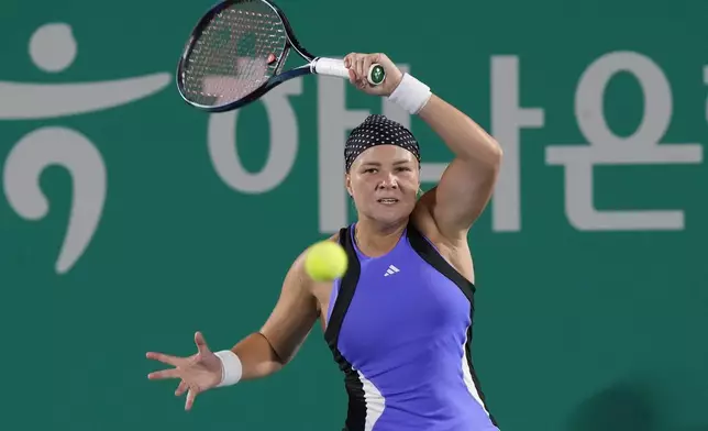 Diana Shnaider of Russia returns a shot to Daria Kasatkina of Russia during their semi final match of the Korea Open tennis championships in Seoul, South Korea, Saturday, Sept. 21, 2024. (AP Photo/Ahn Young-joon)