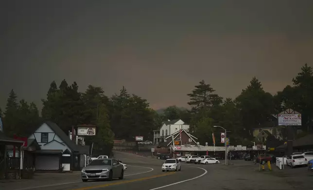 Smoke from the Line Fire fills the air Saturday, Sept. 7, 2024, in Running Springs, Calif. (AP Photo/Eric Thayer)