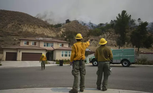 Fire crews monitor the Line Fire Saturday, Sept. 7, 2024, in Highland, Calif. (AP Photo/Eric Thayer)