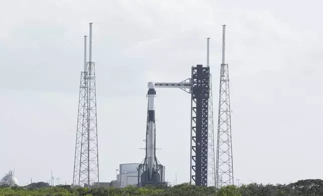 A SpaceX Falcon 9 rocket sits on Launch Complex 40 at the Space Force Station Friday, Sept. 27, 2024, in Cape Canaveral, Fla. Two astronauts are scheduled to begin a mission on Saturday afternoon to the International Space Station. (AP Photo/Chris O'Meara)