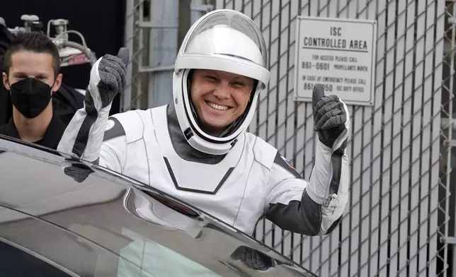 Roscosmos cosmonaut Aleksandr Gorbunov reacts as he leaves the Operations and Checkout building for a trip to the launch pad 40 Saturday, Sept. 28, 2024, at the Kennedy Space Center in Cape Canaveral, Fla. (AP Photo/Chris O'Meara)