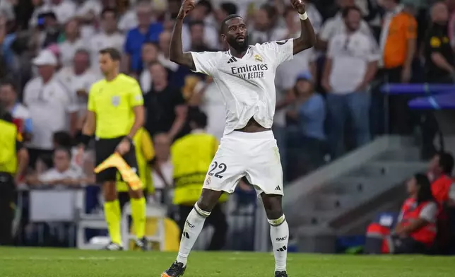 Real Madrid's Antonio Rudiger celebrates after scoring his side's second goal during the Champions League opening phase soccer match between Real Madrid and VfB Stuttgart at the Santiago Bernabeu stadium, in Madrid, Tuesday, Sept. 17, 2024. (AP Photo/Manu Fernandez)