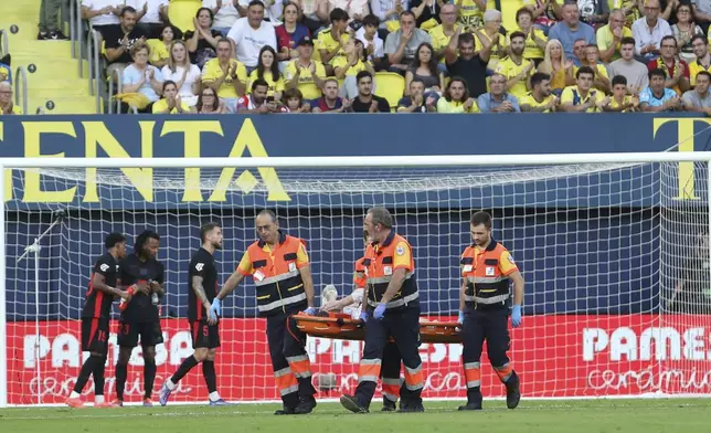 Barcelona's goalkeeper Marc-Andre ter Stegen is removed from the pitch on a stretcher after picking up an injury during a Spanish La Liga soccer match against Villarreal at the La Cerámica stadium in Villarreal, Spain, Sunday, Sept. 22, 2024. (AP Photo/Alberto Saiz)