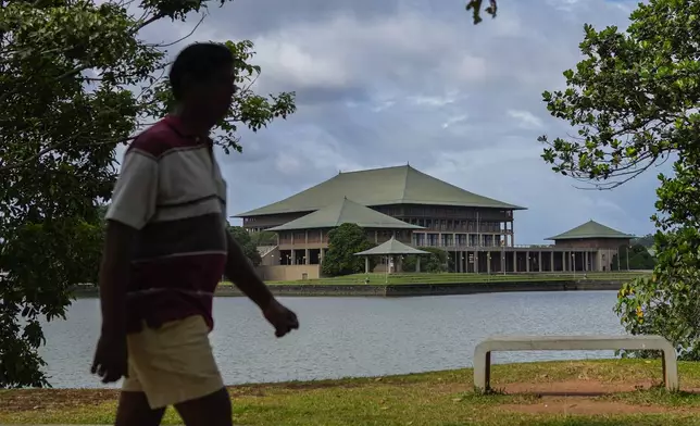 A man walks outside parliamentary complex in Colombo, Sri Lanka, Wednesday, Sept. 25, 2024. (AP Photo/Eranga Jayawardena)
