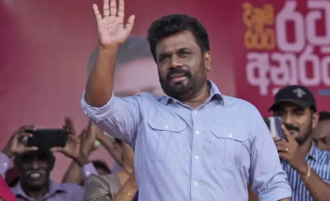 FILE -Leader and the presidential candidate of National People's Power Anura Kumara Dissanayake waves to supporters during a public rally in Dehiowita, Sri Lanka, Sept. 17, 2024. (AP Photo/Eranga Jayawardena, File)