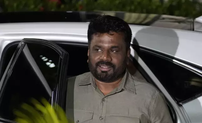 Marxist lawmaker Anura Kumara Dissanayake arrives at the election commission office after winning Sri Lankan presidential election, in Colombo, Sri Lanka, Sunday, Sept. 22, 2024. (AP Photo/Eranga Jayawardane)