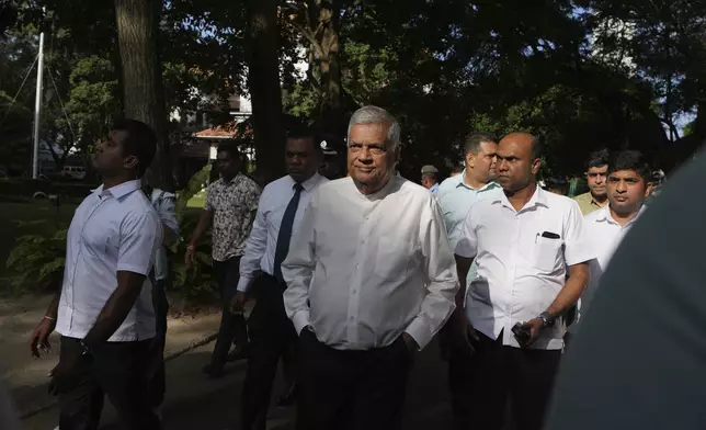 Sri Lankan president and independent presidential candidate Ranil Wickremesinghe arrives to cast his vote in Colombo, Sri Lanka, Saturday, Sept. 21, 2024. (AP Photo/Rajesh Kumar Singh)