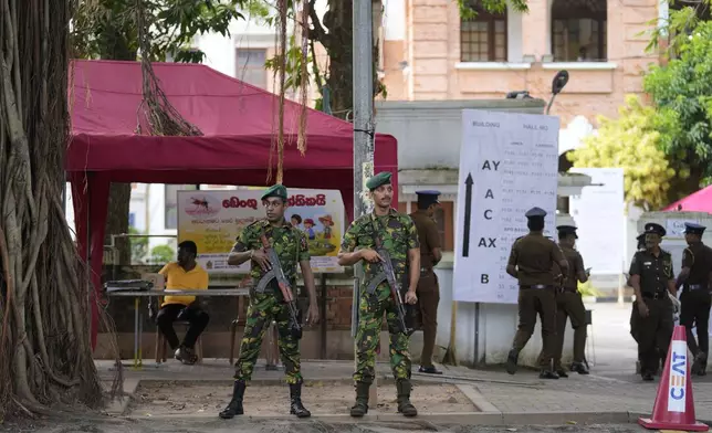 Police commandos stand guard outside a ballot counting center in Colombo, Sri Lanka, Sunday Sept. 22, 2024. (AP Photo/Eranga Jayawardane)