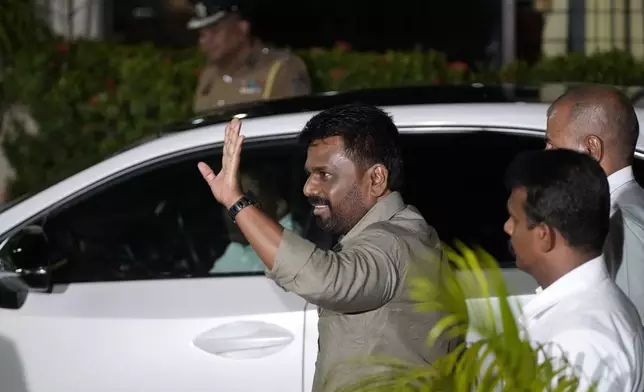 Marxist lawmaker Anura Kumara Dissanayake waves as he arrives at the election commission office after winning Sri Lankan presidential election, in Colombo, Sri Lanka, Sunday, Sept. 22, 2024. (AP Photo/Eranga Jayawardane)